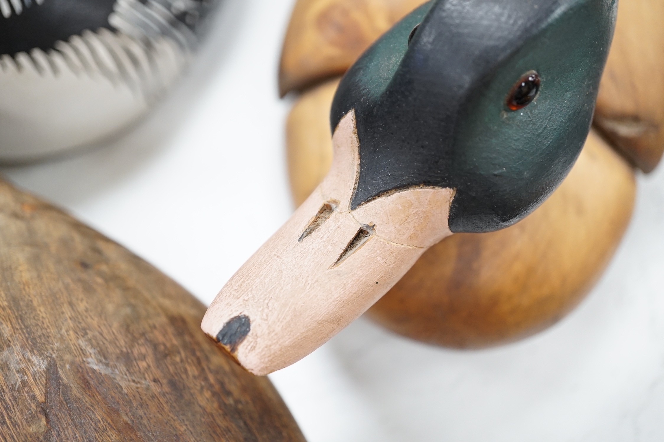 Nine carved wood decoy ducks